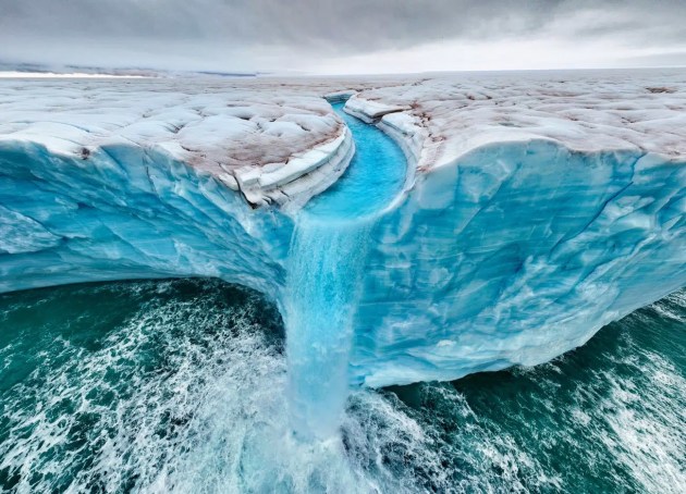 Roie Galitz, Israel. Winner, Planet Earth – Landscape, Climate & Water Portfolio
Location: Bråsvellbreen, Svalbard
“More waterfalls carve the landscape of Bråsvellbreen. As ice caps and glaciers melt faster in our polar regions, we will lose so much of this fragile environment to climate change. As these waters flow into the ocean, they accelerate coastal threats worldwide, emphasizing the urgency of addressing climate change to protect vulnerable ecosystems and human populations alike.”