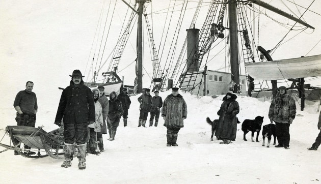 In May 1913, Wilkins joined the Canadian Arctic Expedition as expedition photographer and cinematographer. At the time, it was the largest and best resourced polar expedition in history, with four major ships and a dozen specialist scientists. Three years of exploration and research were planned on its ultimately futile quest to find the continent supposed to exist at the North Pole. In three years in the Arctic, Wilkins survived ice cracking beneath his feet, traveling in frost biting storms that the locals themselves pleaded he not attempt, and a fight with a polar bear where he was saved by the distraction provided by a barking dog. In this image, chief scientist Dr Rudolph Anderson and the crew of the steam-whaler, The Belvedere, on which the crew would spend three months, are pictured near Barter Island, Alaska. Image courtesy: Byrd Polar and Climate Research Centre.