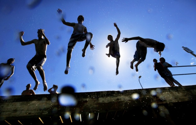 Melbournian's deal with the extreme hot weather in their own special ways as the temperature climbed beyond 40 degrees for three days in a row in 2009. Here, locals in Sandringham jump off the pier.