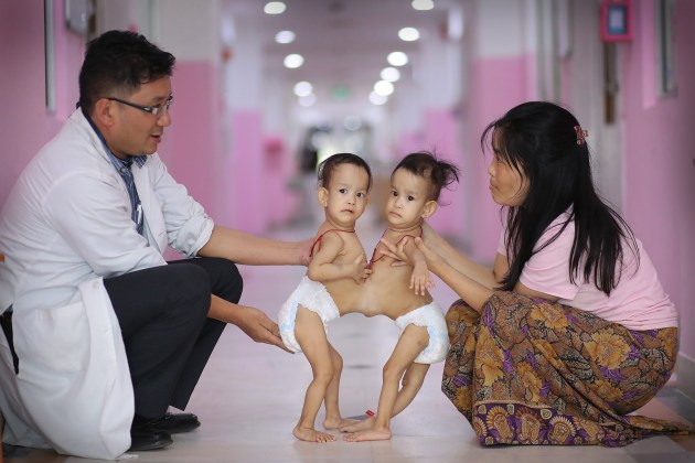 One of the biggest domestic stories of 2018 was that of conjoined 15-month-old twins Nima and Dawa, who were brought to Australia with their mother from Bhutan as doctors in their home country did not have the surgical experience necessary to carry out the complicated operation to separate them. Here, Paediatrician Dr Karma Sherub, and mum Bhumchu hold her daughters before their journey to Australia. Alex described capturing the family’s journey from Bhutan to Australia as a career highlight. Canon 1D X Mark II, EF85mm f/1.8 USM lens. 1/400s @ f1.8, ISO 2000.