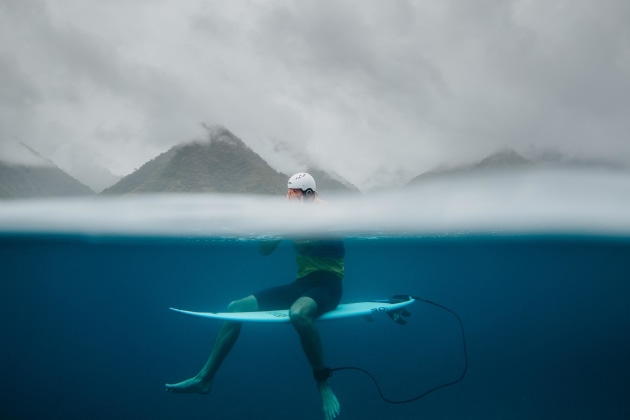 Surfer Owen Wright overcome with emotion. Here, I dunked the port of the water housing half beneath the surface to show how clear and blue the water is with the mountains in the background. This is an incredible setting for these athletes to compete. Canon 1D X Mark II, EF24-70mm f/2.8L II USM lens @ 24mm. 1/2000s @ f5.6, ISO 400.