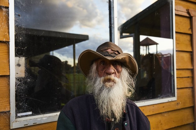 Uncle Peter Robinson #1 stands in front of the old weather shed at the Kinchela Boys Home Site during a site visit.