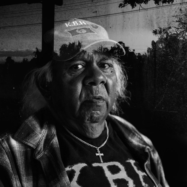 Uncle Trevor Elwood #32 poses for a portrait. This portrait was taken in the old boys’ dormitory at the Kinchela Boys Home site, 4.5 hrs north of Sydney, Australia. The second layer is a photo of a reflection of the site.
“We used to write letters to family, but they never received them. I don’t know what they [the staff] did with them. Maybe they burnt them… it’s all lies. Everything was all lies. I found that out as I grew older and older.” Uncle Trevor Elwood #32. Image: Tace Stevens for Magnum Foundation & World Monuments Fund.